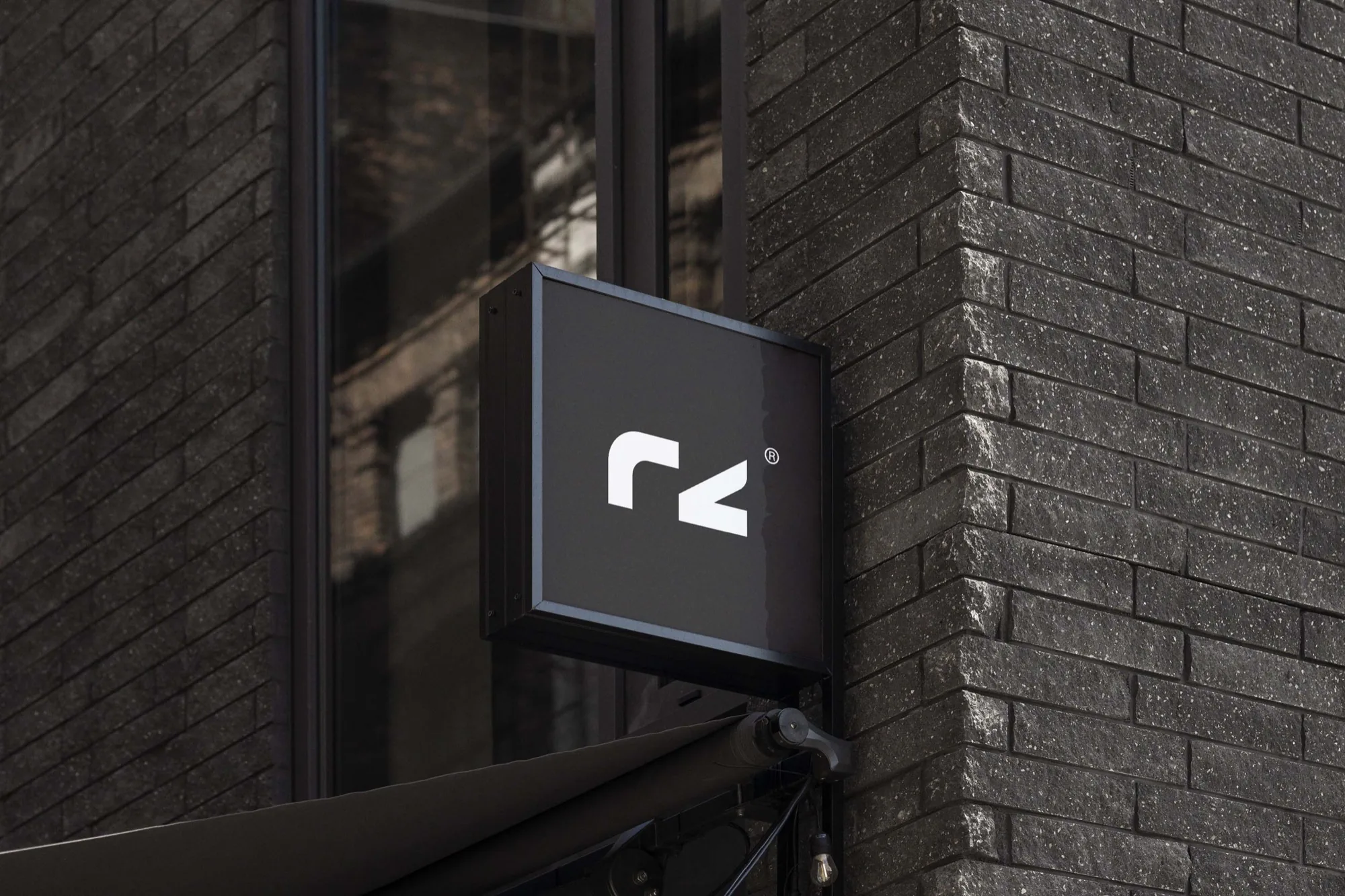Romeo Zúlu Investment Capital — the rz mark on a projecting shopfront sign